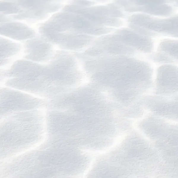 Close-up of a smooth white plaster pool finish under rippling water
